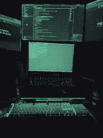 Patrick’s desk at night, rendered in green pixels